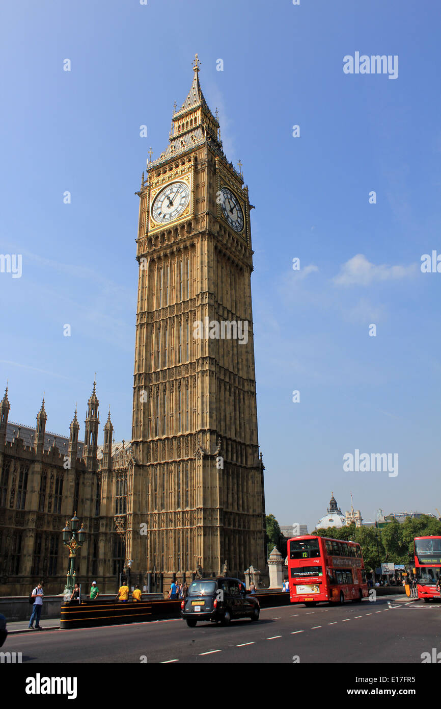 Big Ben and the Houses of Parliament, with a black taxi and red double-decker bus on Westminster Bridge, London, England, UK Stock Photo