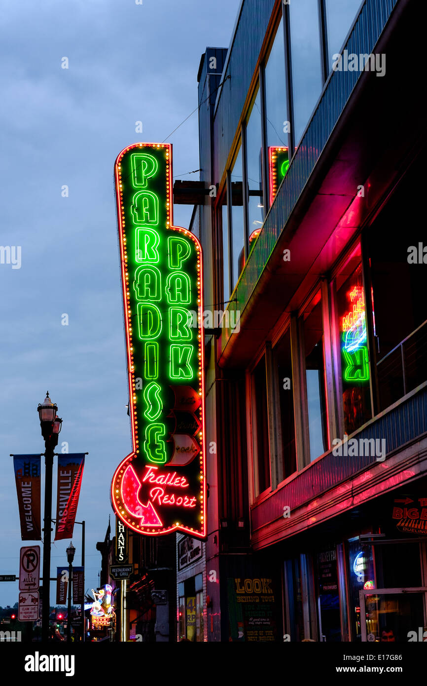 Neon signs at Paradise Park illuminate Broadway Street in Downtown