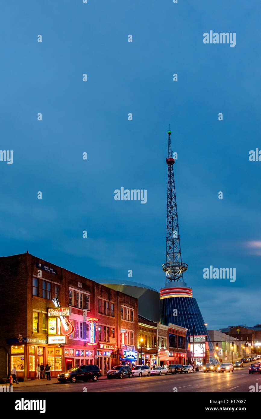Neon signs illuminate Broadway Street in Downtown Nashville, Tennessee