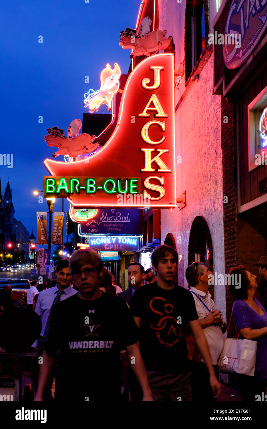 Neon signs at Jacks Bar-B-Que illuminate Broadway Street in Downtown Nashville, Tennessee Stock Photo