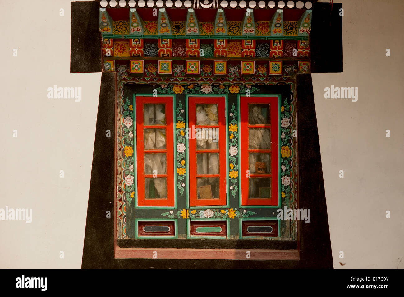 Art in Buddhist Monastery architecture in Sikkim, India - hand crafted and painted windows Stock Photo