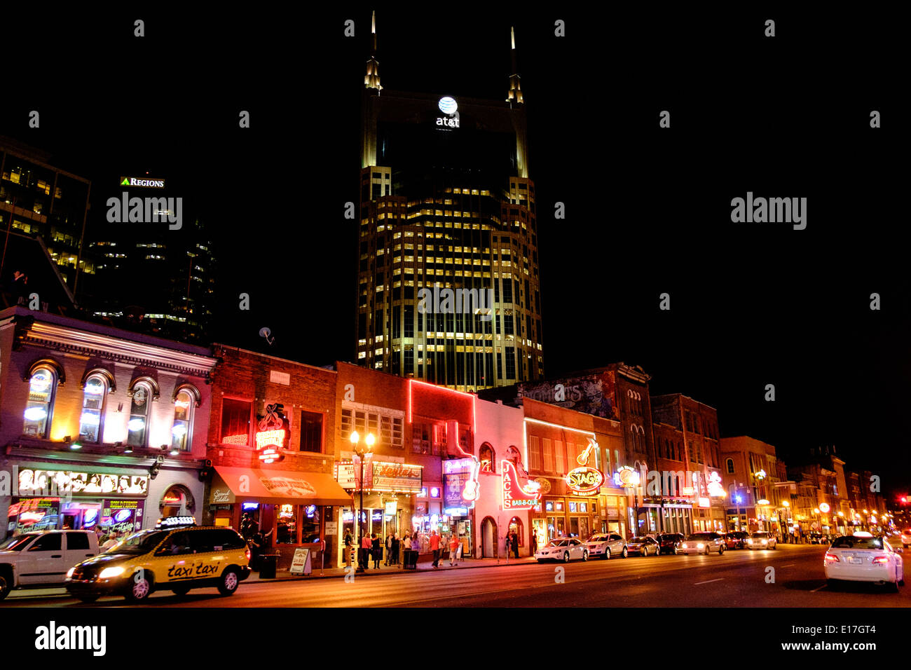 Neon signs illuminate Broadway Street at night in Downtown Nashville