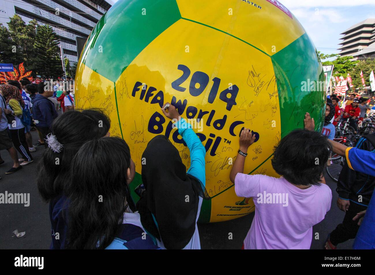 Semarang, Central Java, Indonesia. 25th May, 2014. SEMARANG, CENTRAL JAVA, INDONESIA - MAY 25: Indonesian peoples sign at giant ball to welcome the 2014 FIFA World Cup, International men's football tournament scheduled to take place in Brazil from 12 June to 13 July 2014, in Semarang, Central Java, Indonesia on May 25, 2014. Credit:  Sijori Images/ZUMAPRESS.com/Alamy Live News Stock Photo