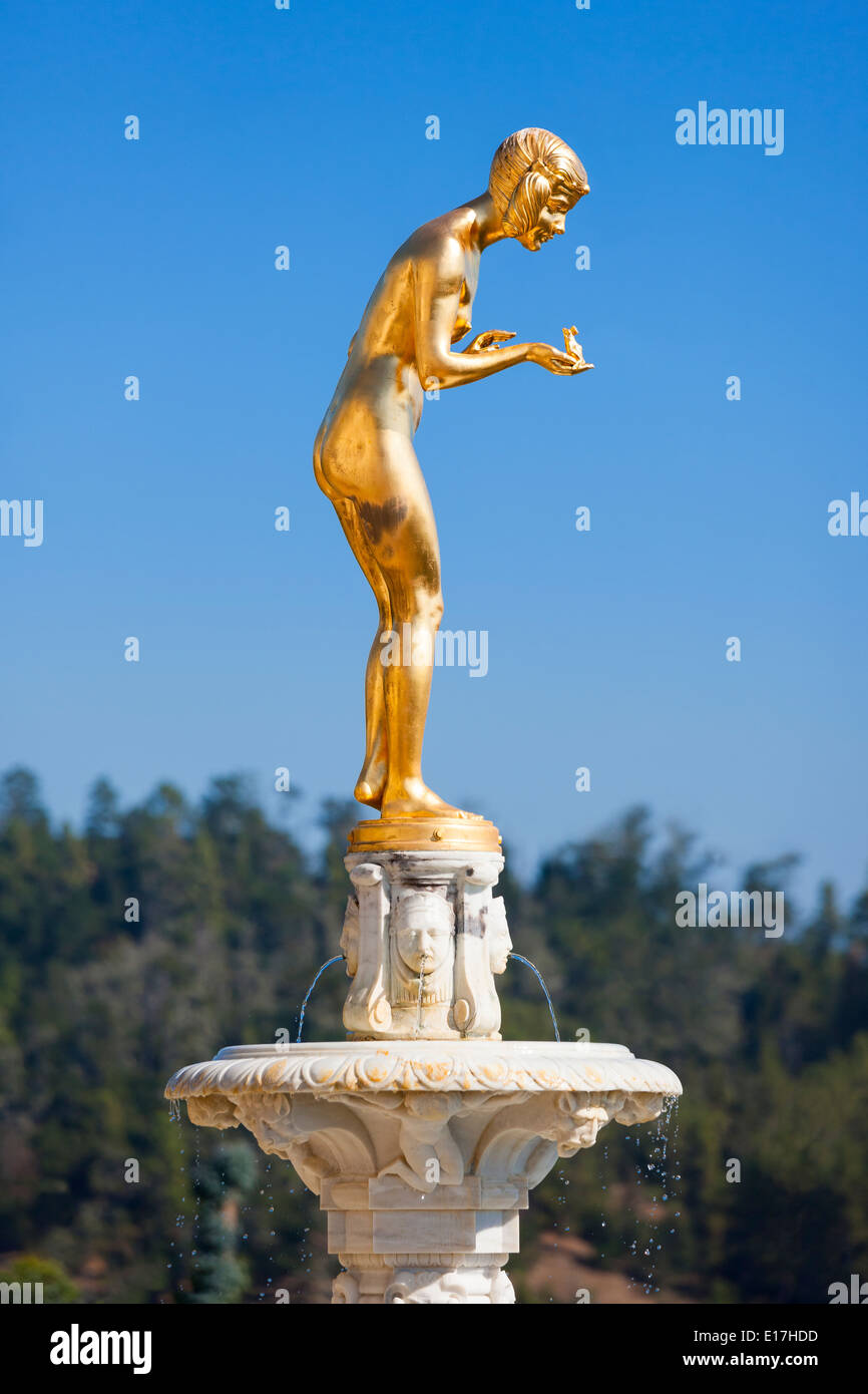 Hearst Castle California. Gold sculpture of a Princess holding a Crowned Frog Prince in her hand, about to kiss him. Stock Photo