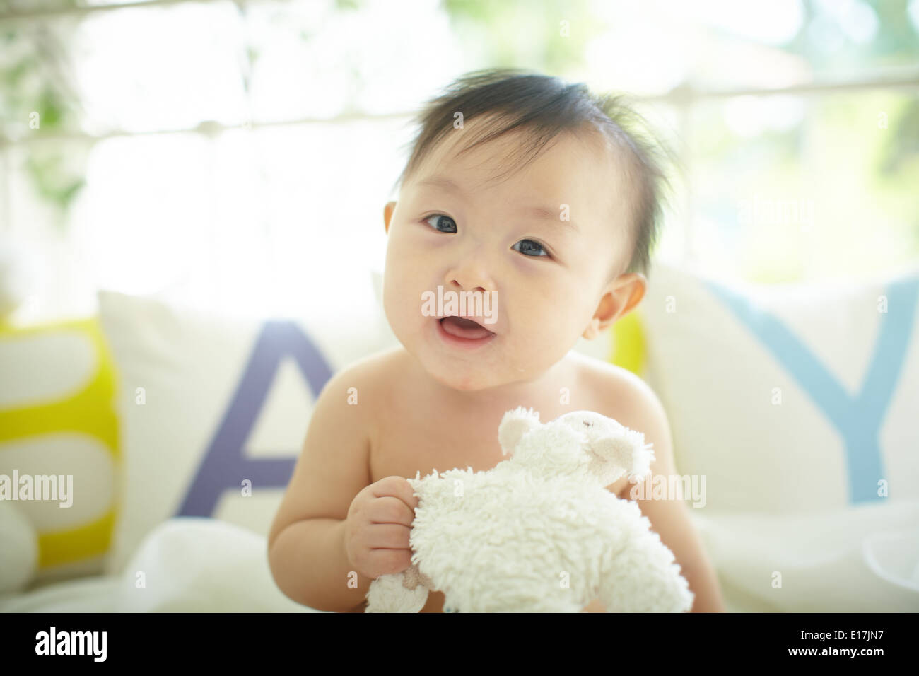 Baby with a big and cute smile Stock Photo