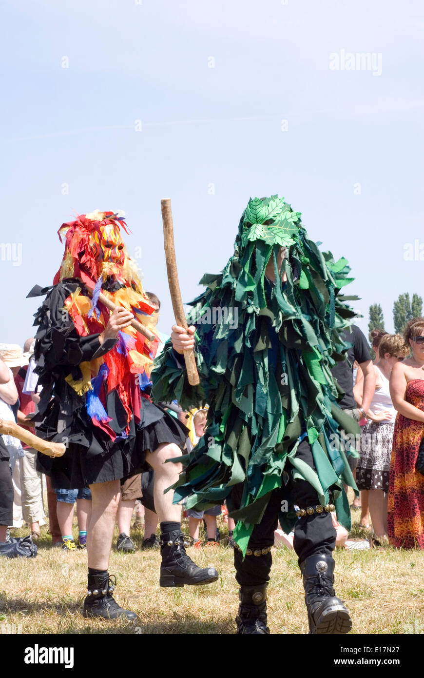 Tewkesbury Medieval Festival, Gloucester UK July 2013: Bedlam morris dancers in green and red rag robes entertain crowd Stock Photo