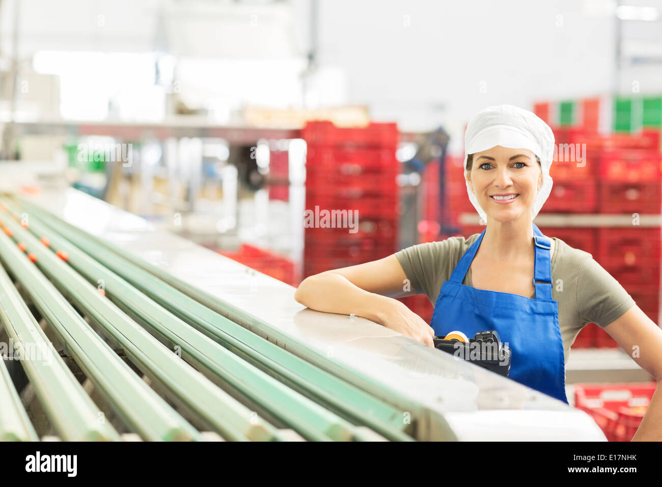 Portrait of confident worker in food processing plant Stock Photo