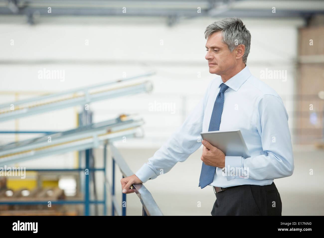 Supervisor with digital tablet in food processing plant Stock Photo