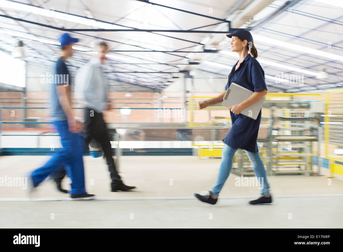 Workers walking in food processing plant Stock Photo Alamy