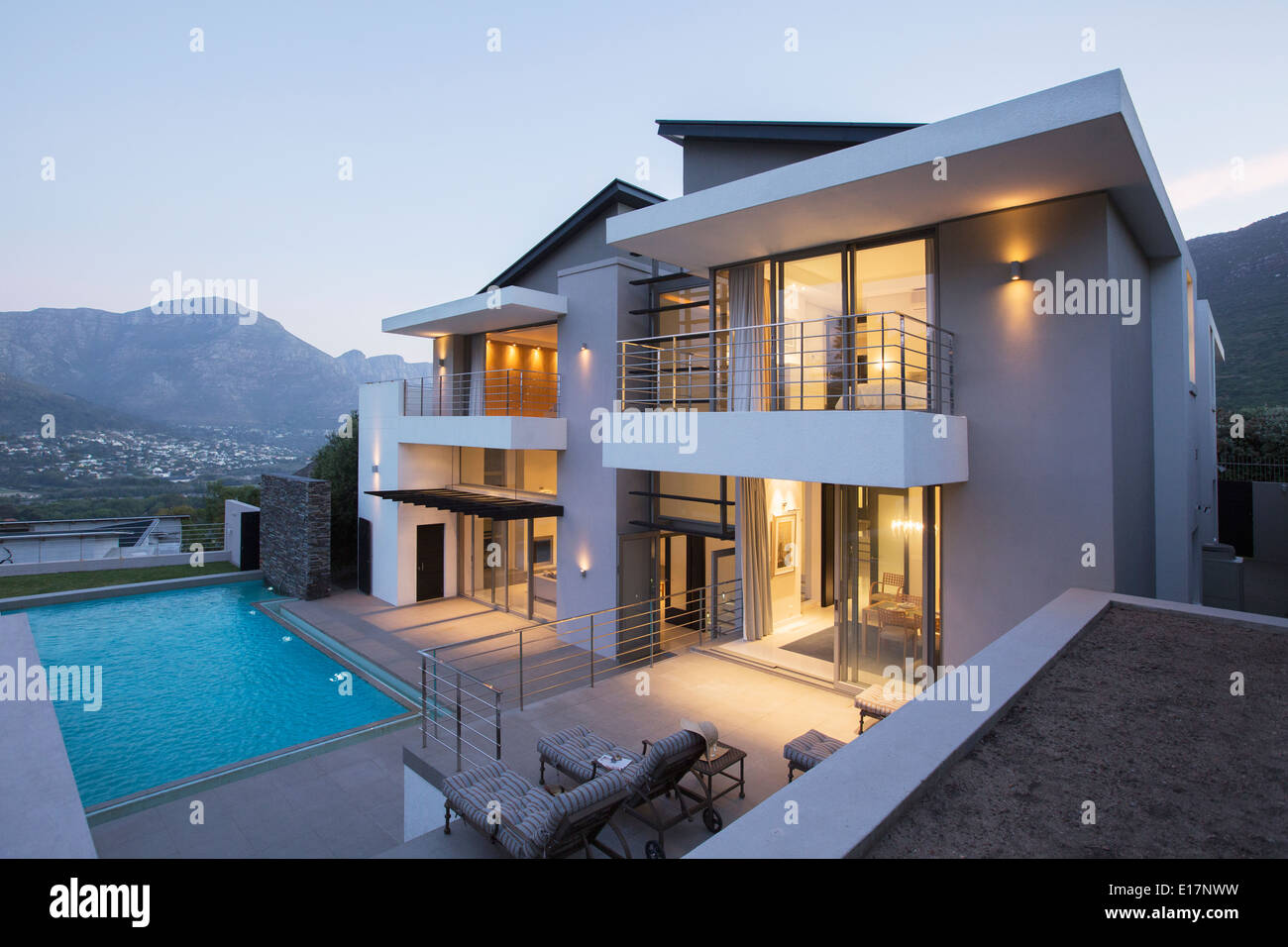 Modern house with swimming pool at dusk Stock Photo