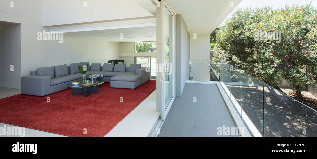 Modern living room open to balcony Stock Photo
