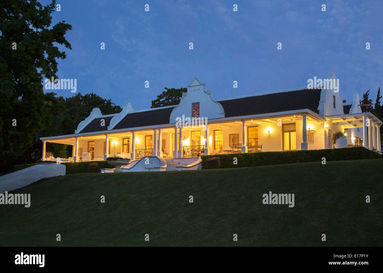 Luxury house and porch illuminated at night Stock Photo