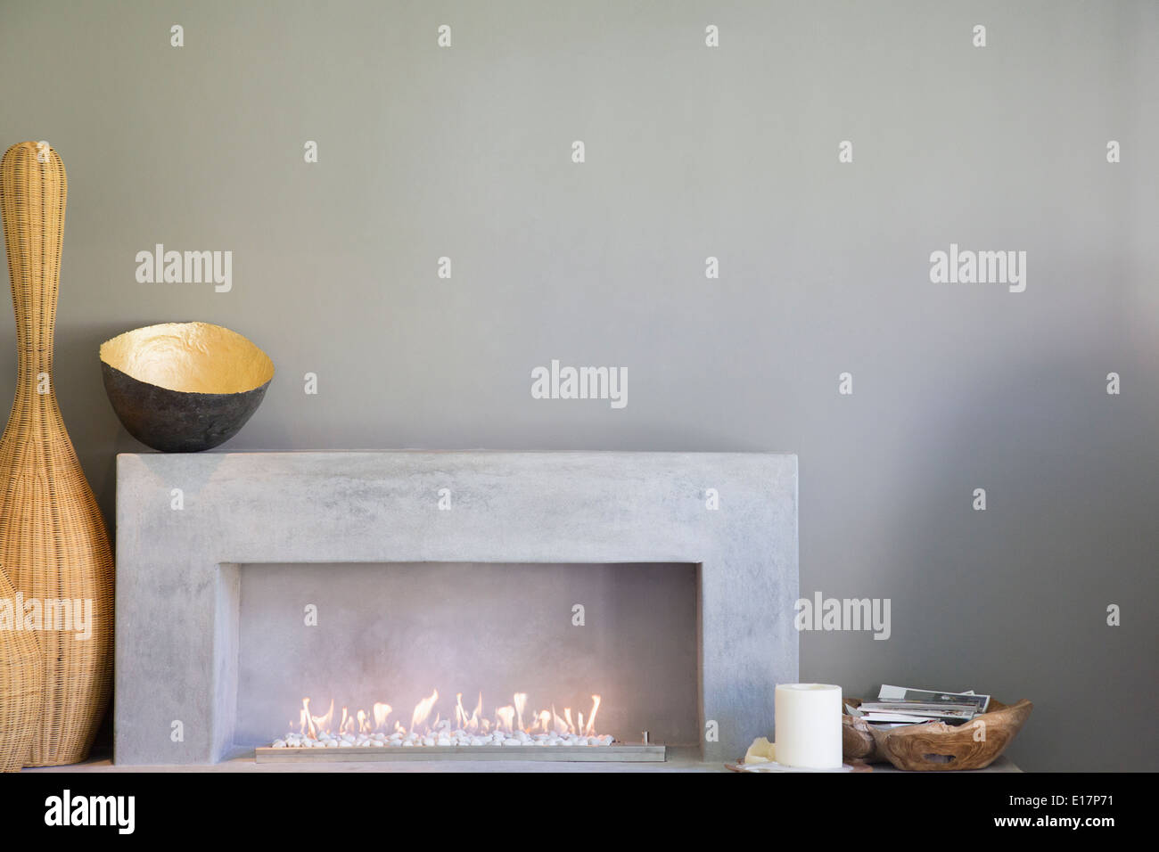 Apple art above fireplace in modern living room Stock Photo