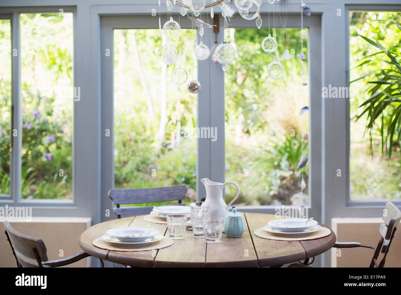 Wooden table in sunroom Stock Photo