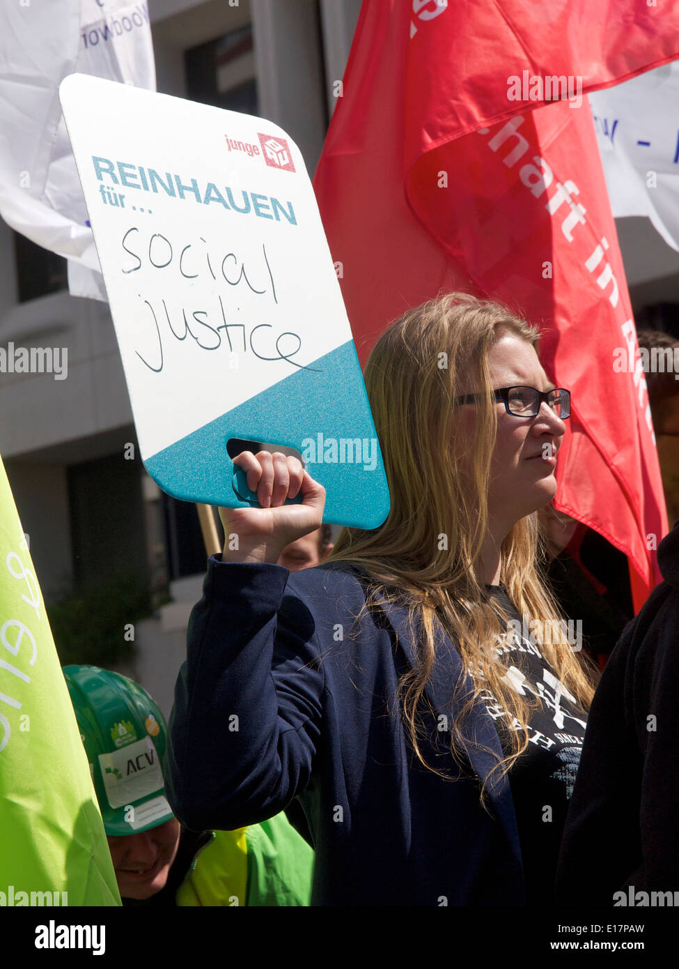 Woman protesting for social justice at the European Commission in Brussels, Belgium Stock Photo