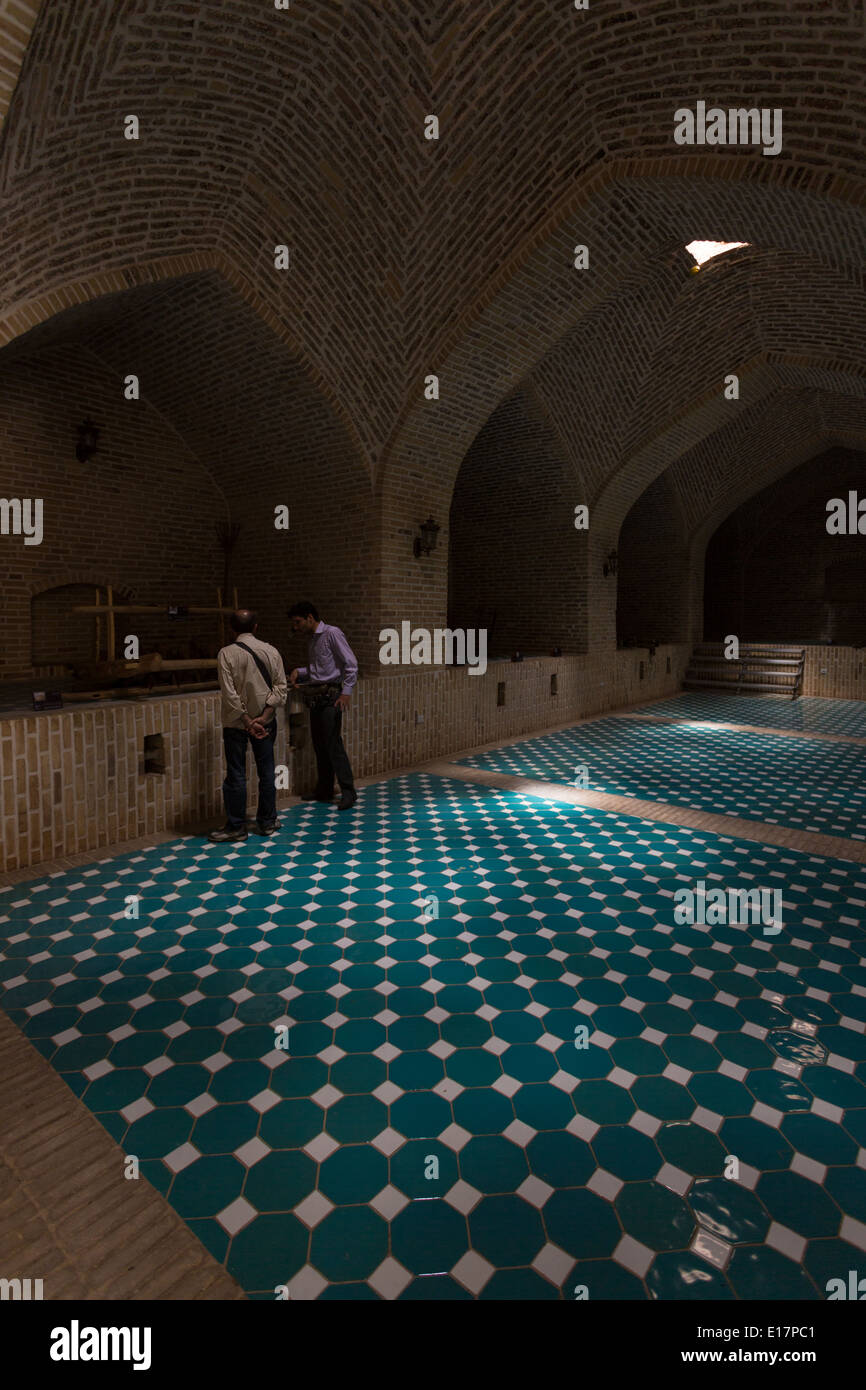 Dim light plays over blue tiles in a restored caravanseria at Bisotun, Iran Stock Photo