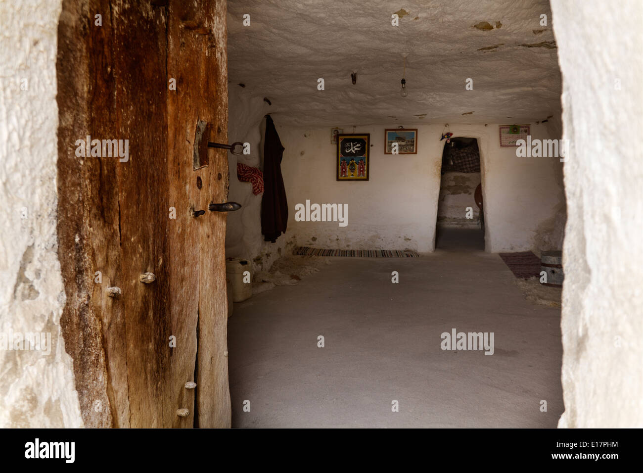Mountainside Berber Village of Chenini, troglodyte dwellings Inside a cave house Stock Photo