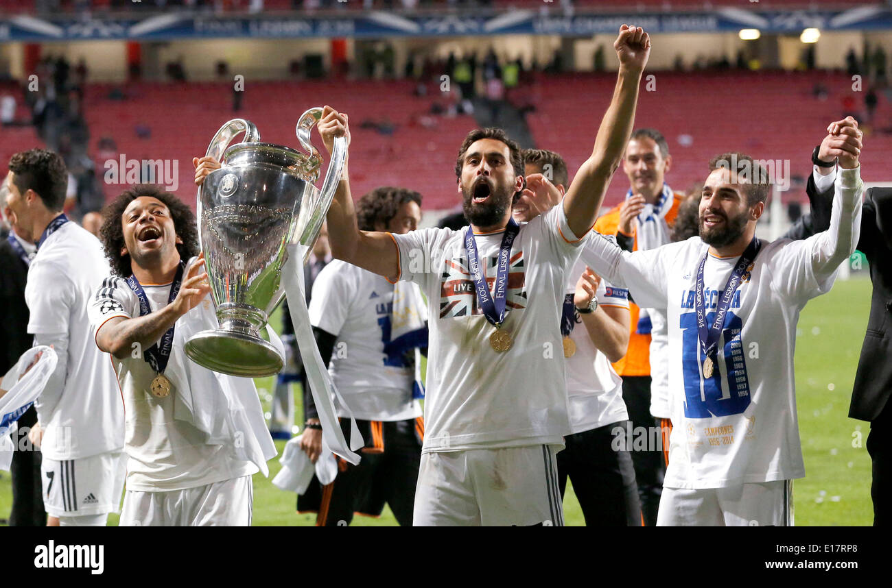 ltr: Marcelo (Real Madrid CF #12), Alvaro Arbeloa (Real Madrid CF #17) and Daniel Carvajal (Real Madrid CF #15) with the trophy during the final of the Champions league between Real Madrid and Atletico Madrid, Estadio da Luz in Lisbon on May 24., 2014. Stock Photo
