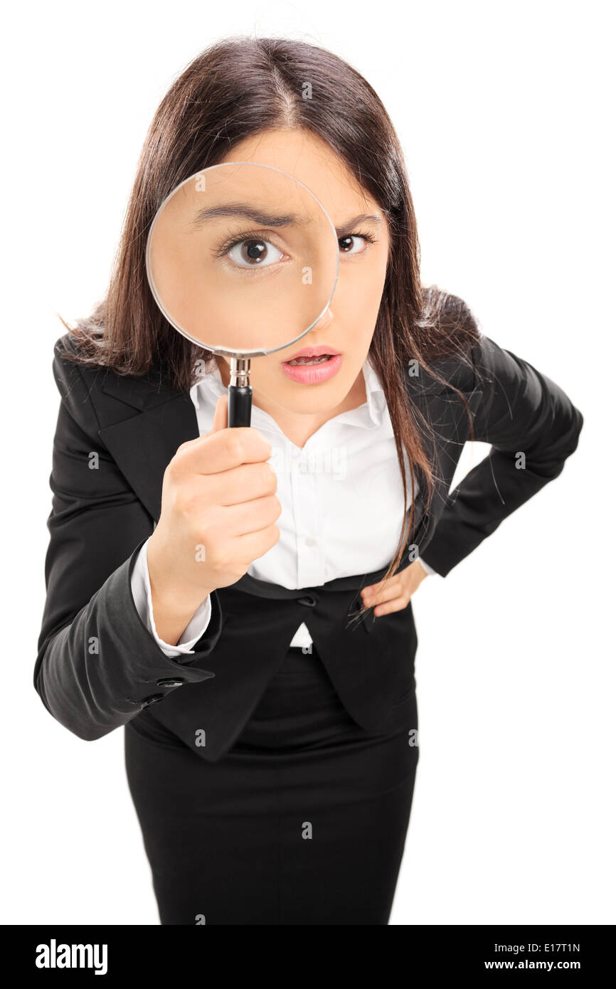 Businesswoman looking through a magnifying glass Stock Photo - Alamy