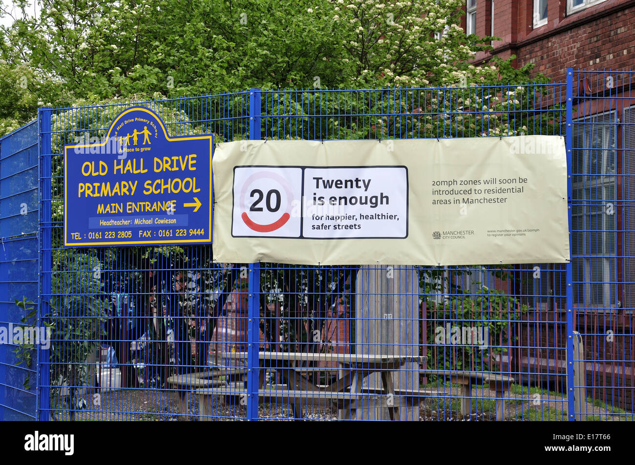 Twenty mph speed limit banner on local school fence Stock Photo