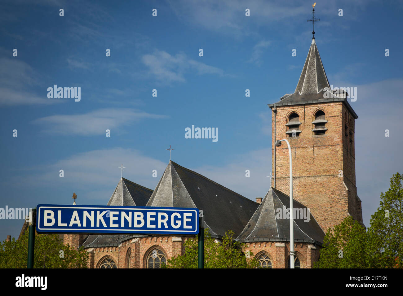 Sint Antonius Church rises above the train terminal sign, Blankenberge, Belgium Stock Photo