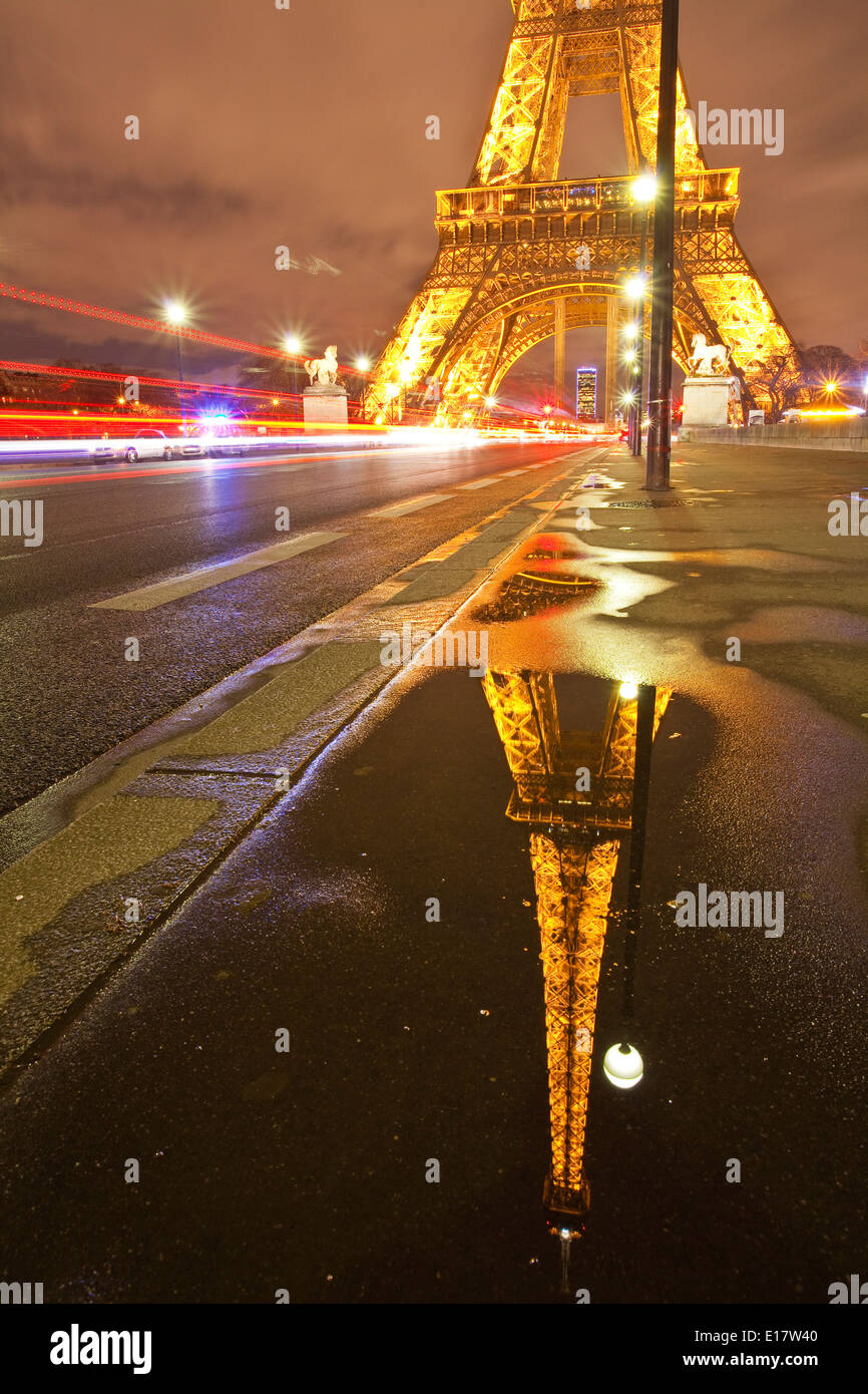 The Eiffel Tower lit up at night. It was named after the engineer