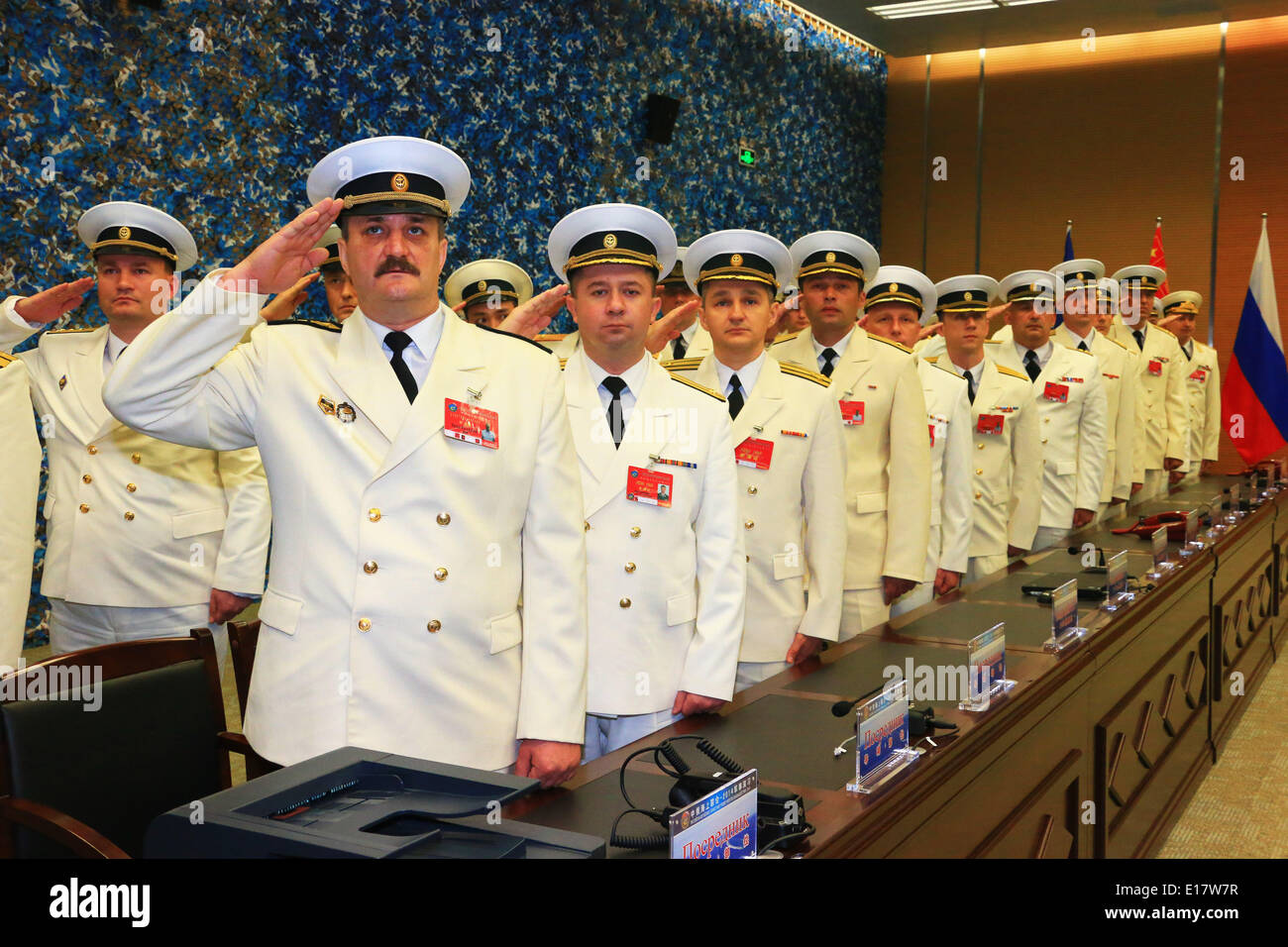 Shanghai, China. 26th May, 2014. Naval officers from Russia salute at the closing ceremony of the China-Russia joint naval drill in Shanghai, east China, May 26, 2014. The directors of two sides announced the end of the drill here on Monday. Credit:  Zha Chunming/Xinhua/Alamy Live News Stock Photo