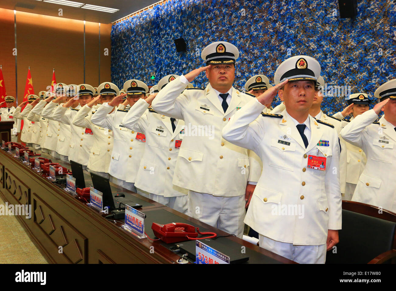 Shanghai, China. 26th May, 2014. Naval officers from China salute at the closing ceremony of the China-Russia joint naval drill in Shanghai, east China, May 26, 2014. The directors of two sides announced the end of the drill here on Monday. Credit:  Zha Chunming/Xinhua/Alamy Live News Stock Photo