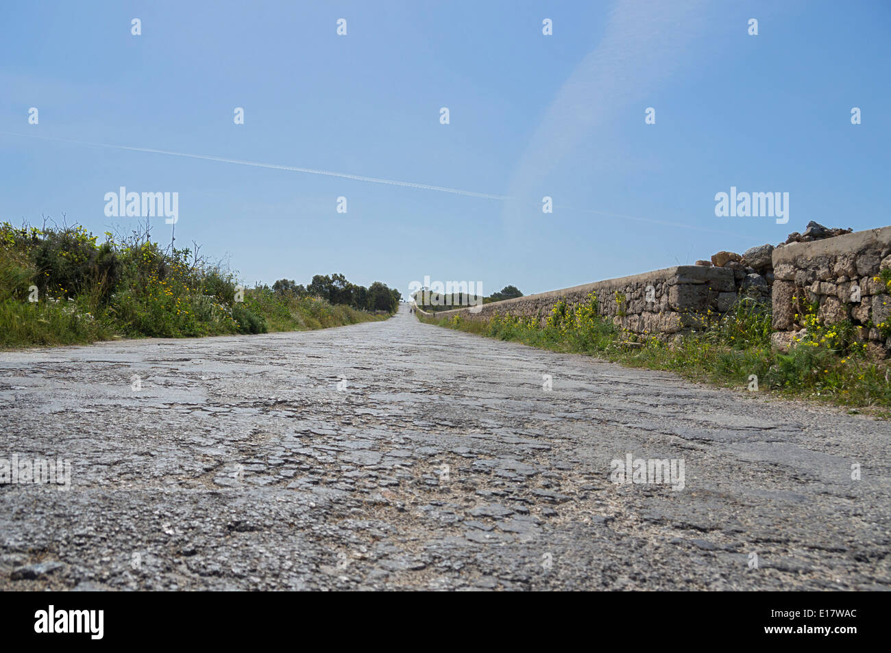 Rough, uneven, bumpy, poor, roads in Malta, Europe. Stock Photo