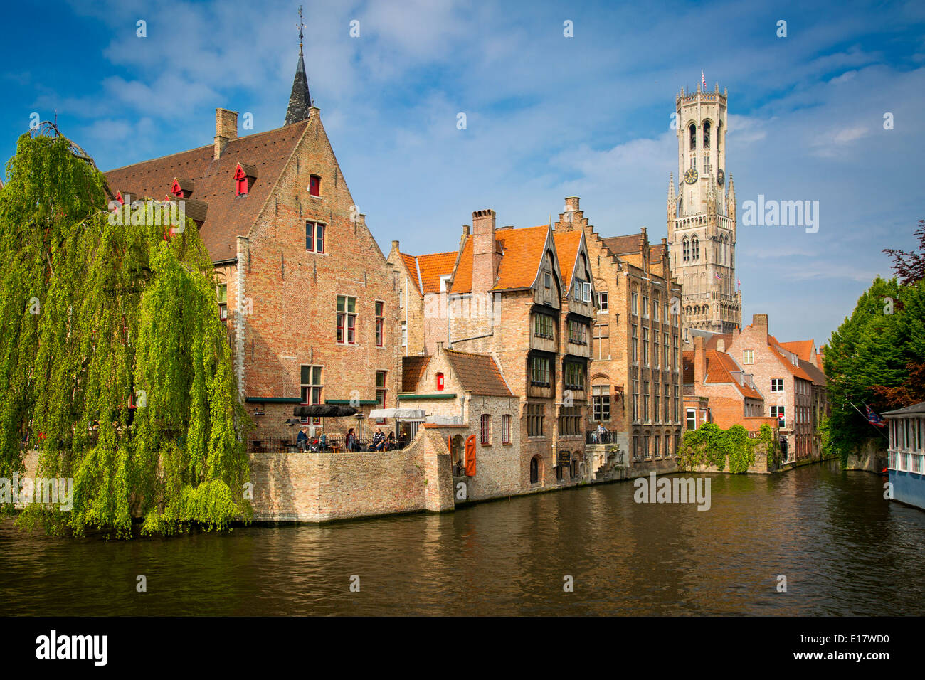 Belfry of Bruges towers over the buildings at the junction of the Groenerei and Dijver canals, Bruges, Belgium Stock Photo