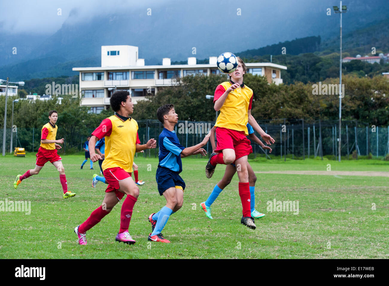 Junior football players heading the ball, Cape Town, South Africa Stock Photo