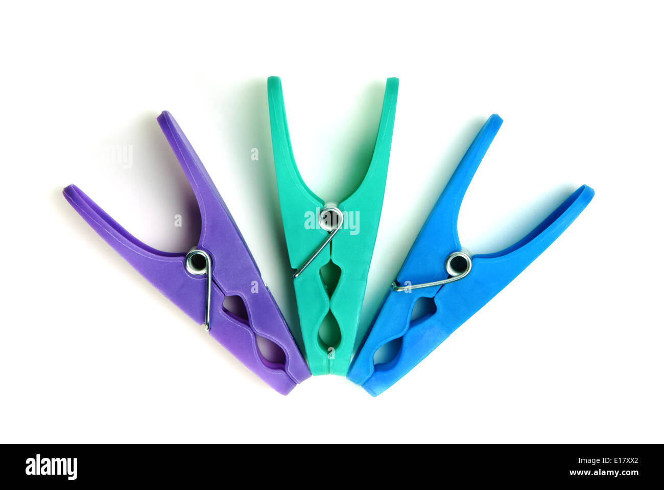 Three plastic clothes pegs on a white background Stock Photo Alamy