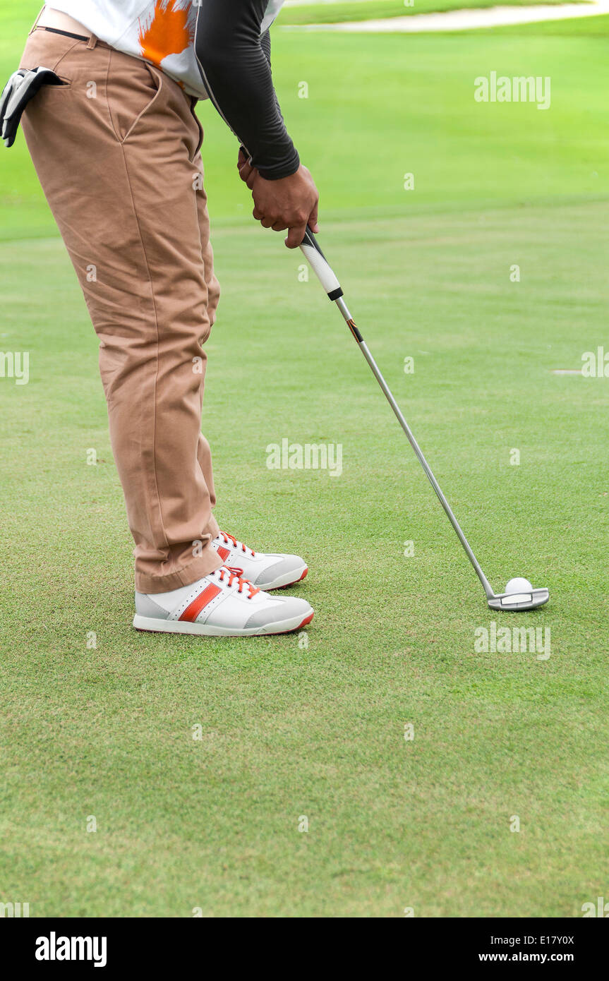 Golfer putting address on green Stock Photo Alamy