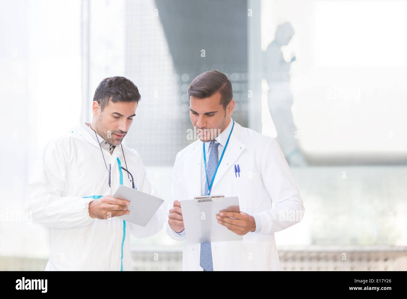 Scientists with digital tablet and clipboard Stock Photo