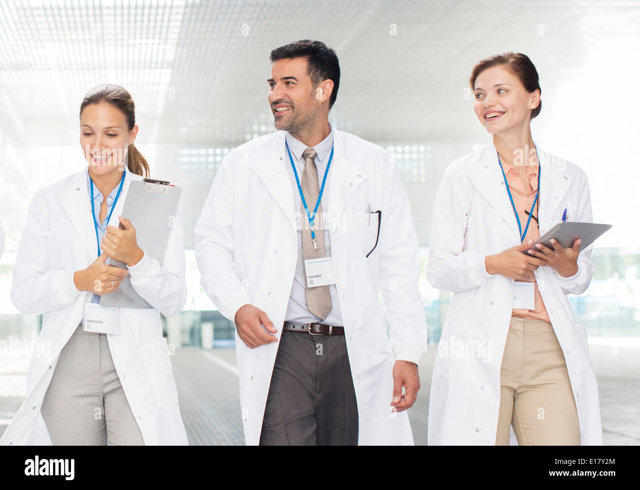 Doctors walking in hospital corridor Stock Photo