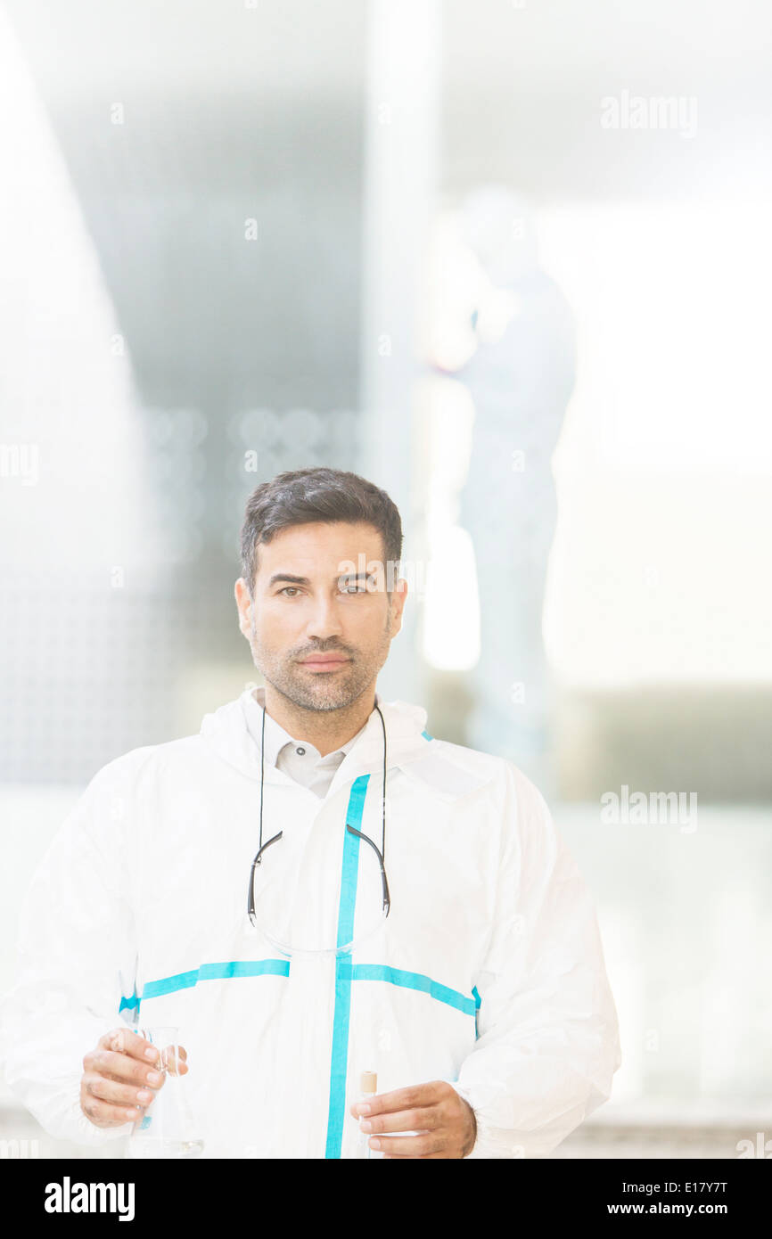 Portrait of confident scientist in clean suit in laboratory Stock Photo