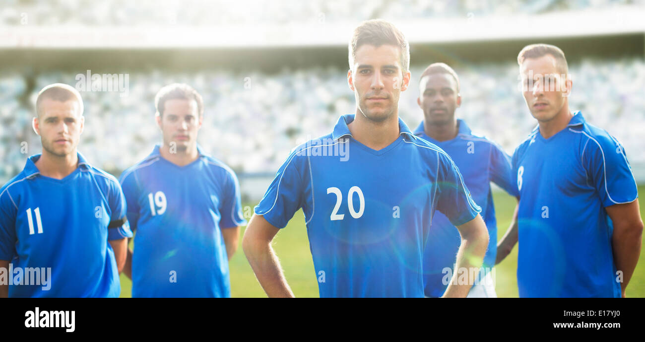 Soccer team standing on field Stock Photo