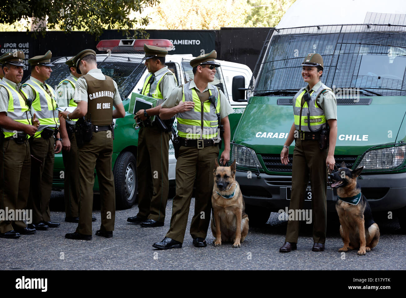 male and female dog handlers carabineros de chile national police officers in downtown Santiago Chile Stock Photo
