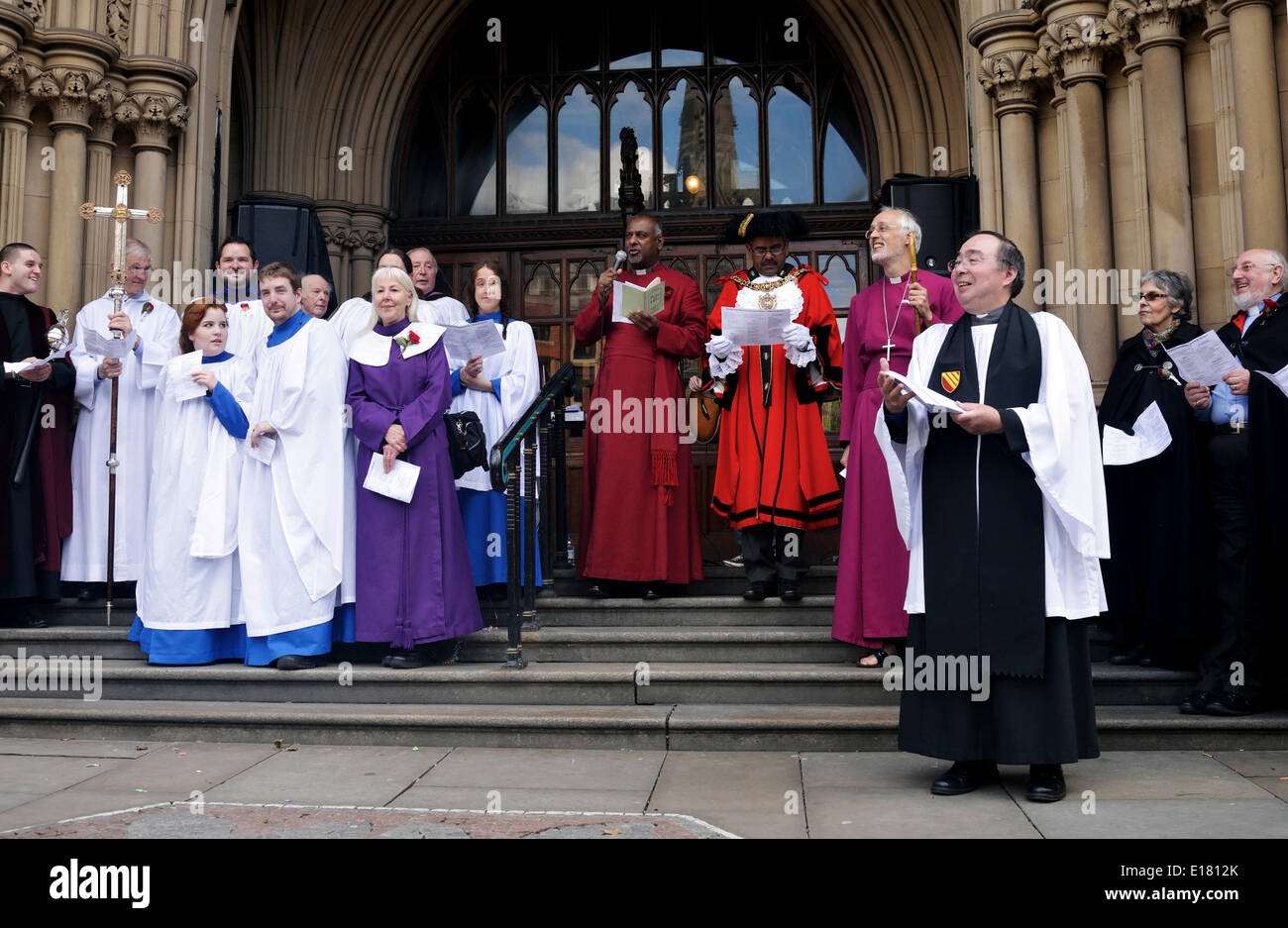 Manchester, UK  26th May 2014 The Dean of Manchester, the Very Reverend Rogers Govander addresses the crowd outside  the Manchester Town Hall during the Manchester and Salford Annual Procession of Witness (the Whit Walk) from Manchester Cathedral to the Town Hall in Albert Square. Manchester and Salford Whit Walk   Manchester, UK Credit:  John Fryer/Alamy Live News Stock Photo