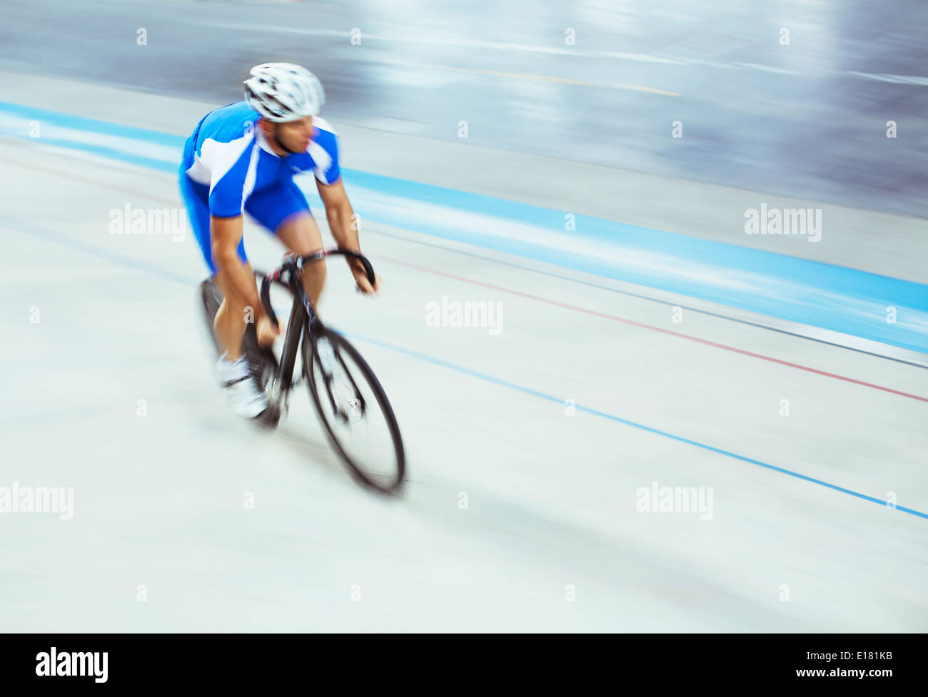 Track cyclist riding in velodrome Stock Photo