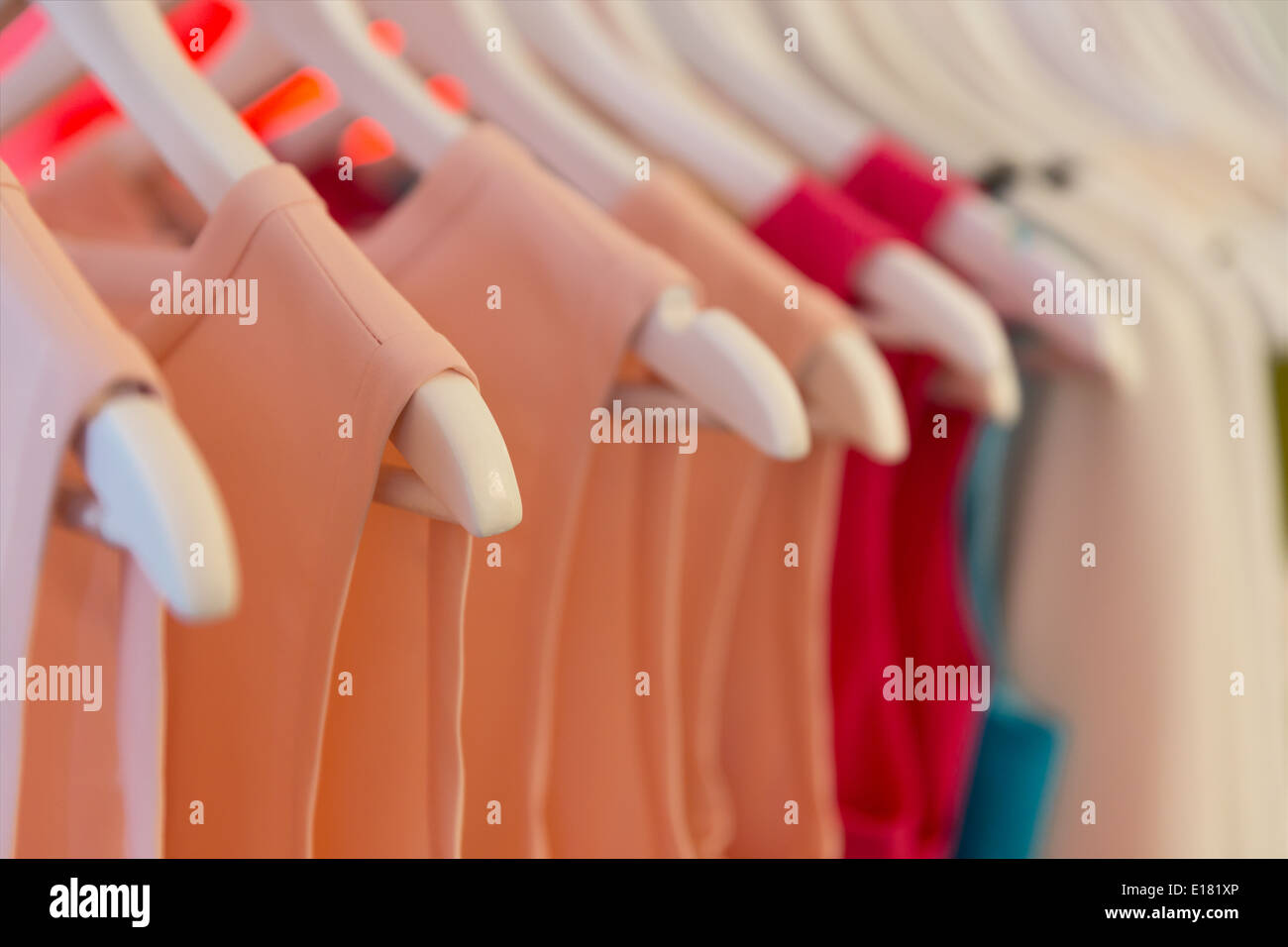 Dresses on clothes hangers Stock Photo