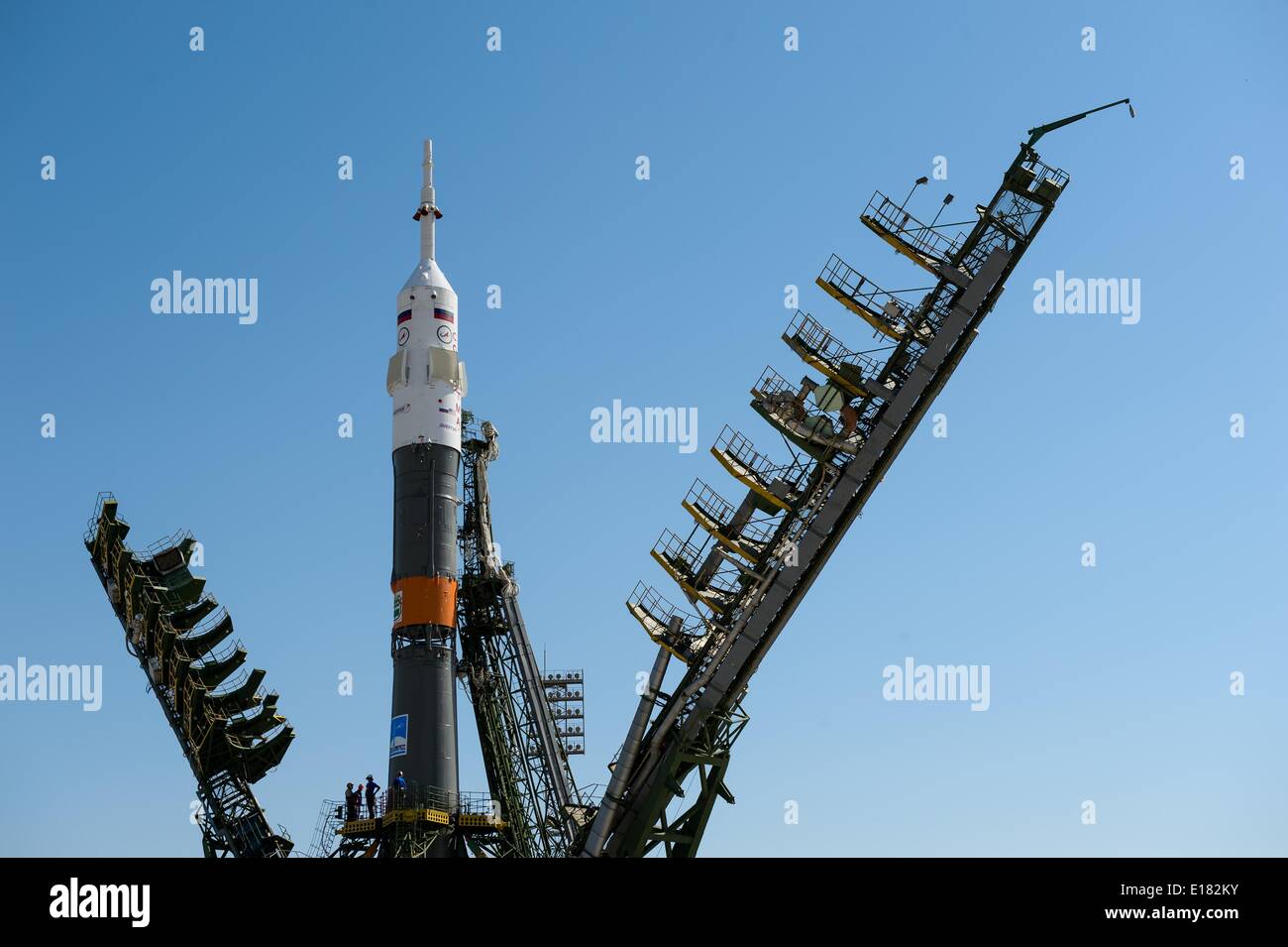 The Roscosmos Soyuz TMA-13M spacecraft is moved into vertical position as the gantry is closed on the launch pad in preparation for launch to the International Space Station May 26, 2014 at the Baikonur Cosmodrome in Kazakhstan. Stock Photo