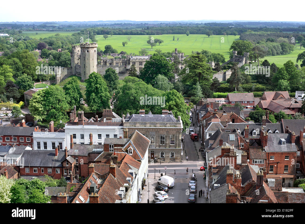 View of part of Warwick town centre, with Church Street in the foreground and Warwick Castle beyond. Stock Photo