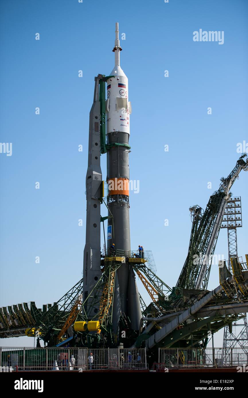 The Roscosmos Soyuz TMA-13M spacecraft is moved into vertical position as the gantry is closed on the launch pad in preparation for launch to the International Space Station May 26, 2014 at the Baikonur Cosmodrome in Kazakhstan. Stock Photo