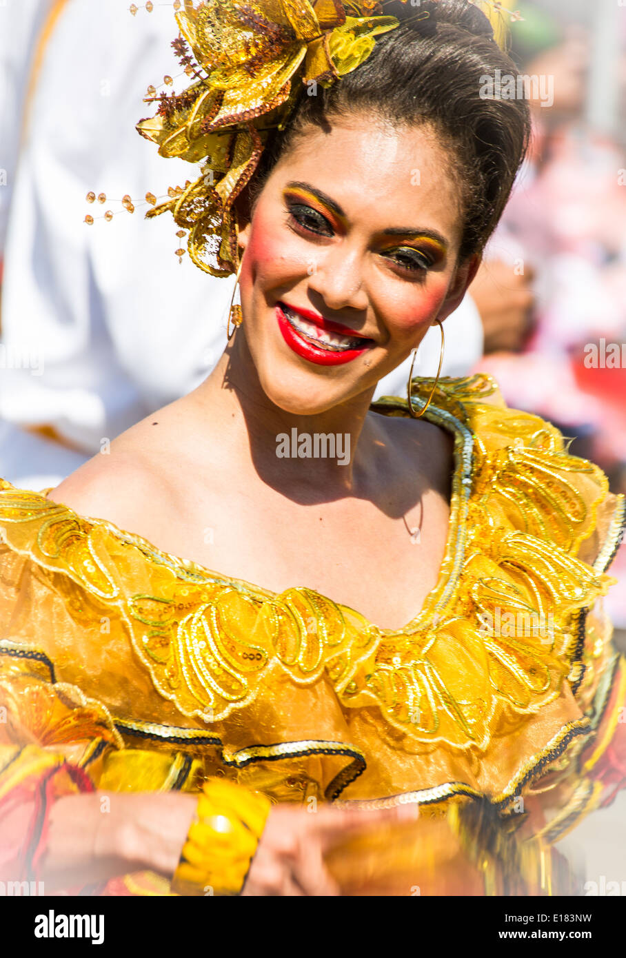 Barranquilla, Colombia - March 1, 2014 - Performers in elaborate costume sing, dance, and stroll their way down the streets of Barranquilla during the Battalla de Flores during Carnival Stock Photo