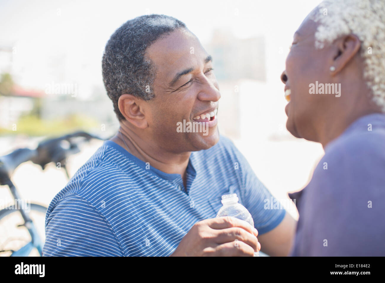 Senior couple laughing outdoors Stock Photo