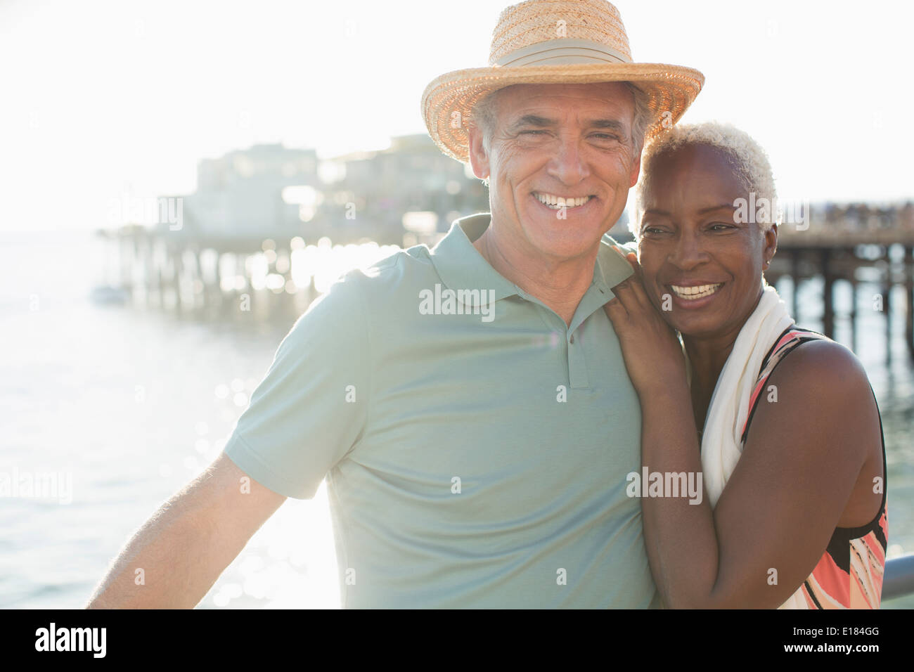 Portrait of happy senior couple on beach Stock Photo
