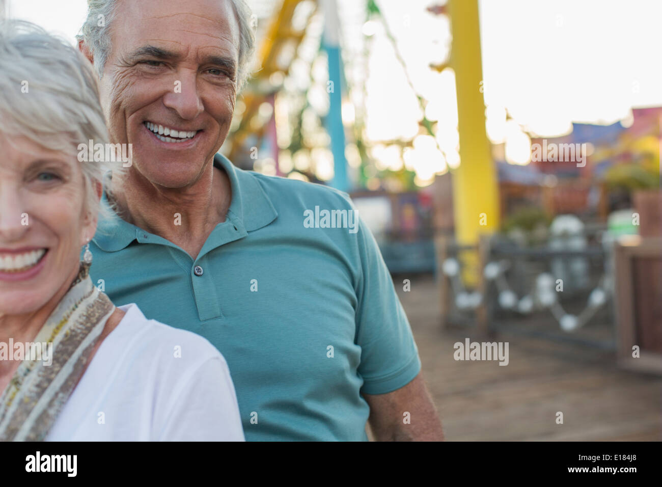 Portrait of senior couple at amusement park Stock Photo