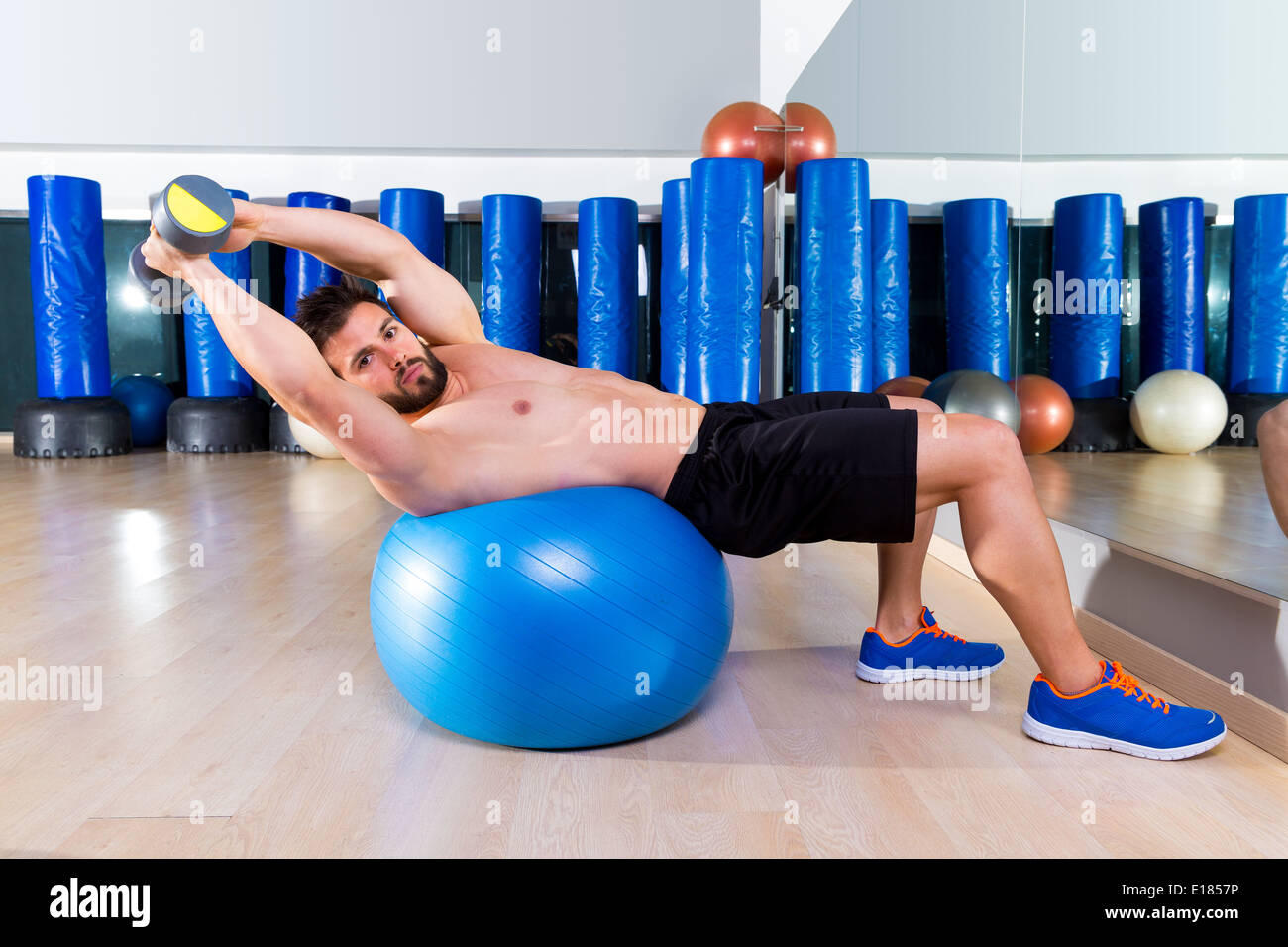 Dumbbell Bench Press On Fit Ball Man Workout At Fitness Gym Stock