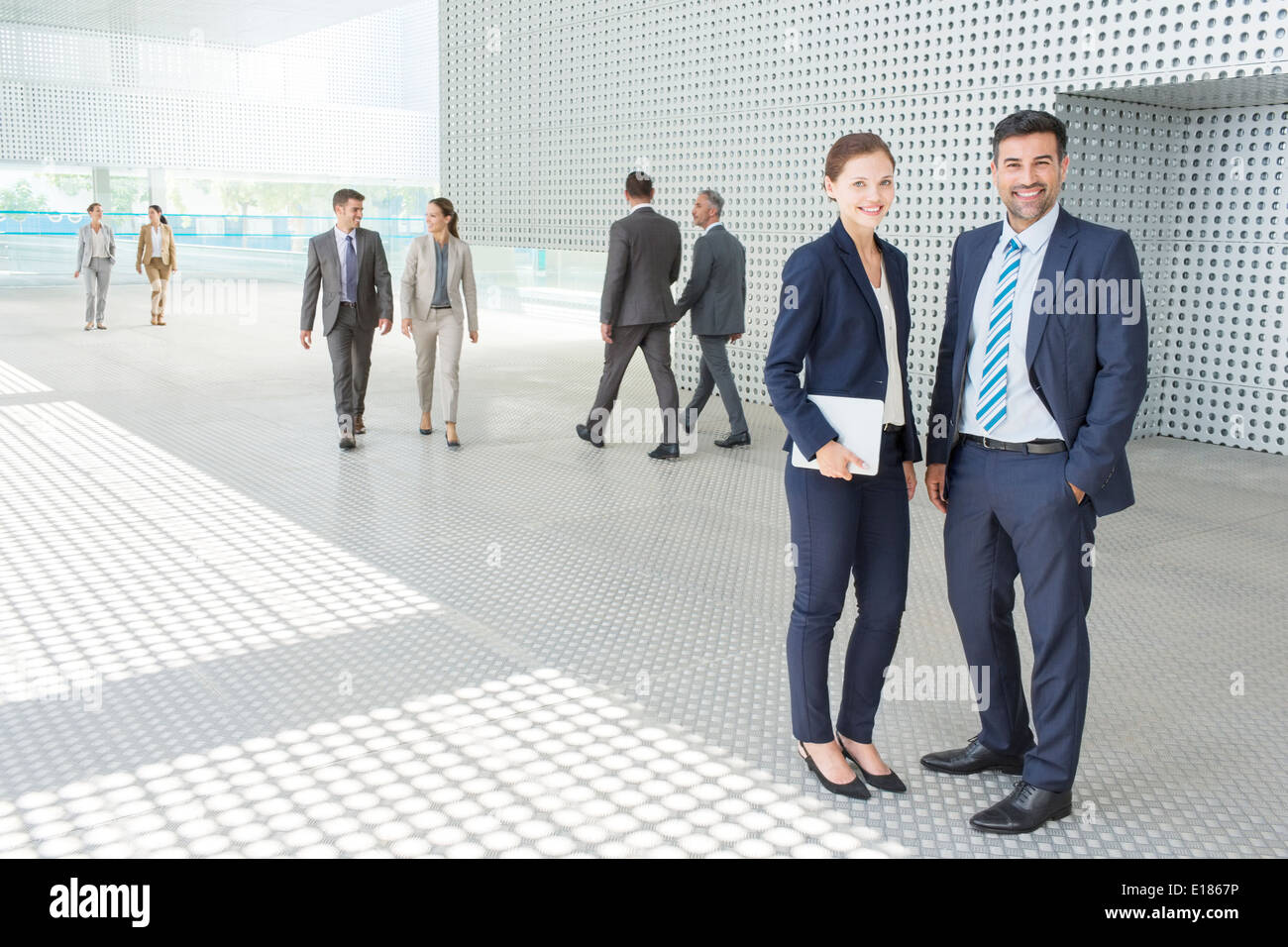 Portrait of business people outside modern building Stock Photo